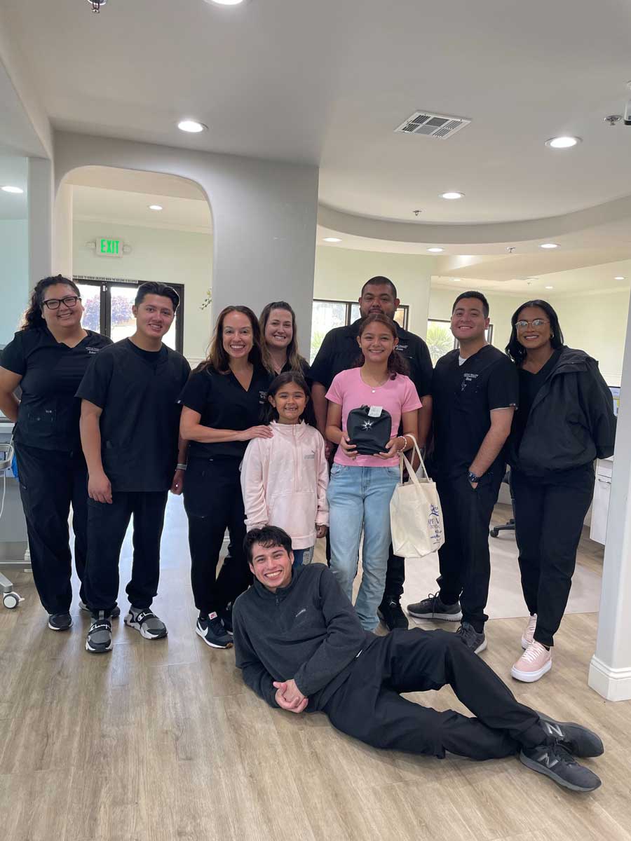 Apple Valley Orthodontics team with smiling patients